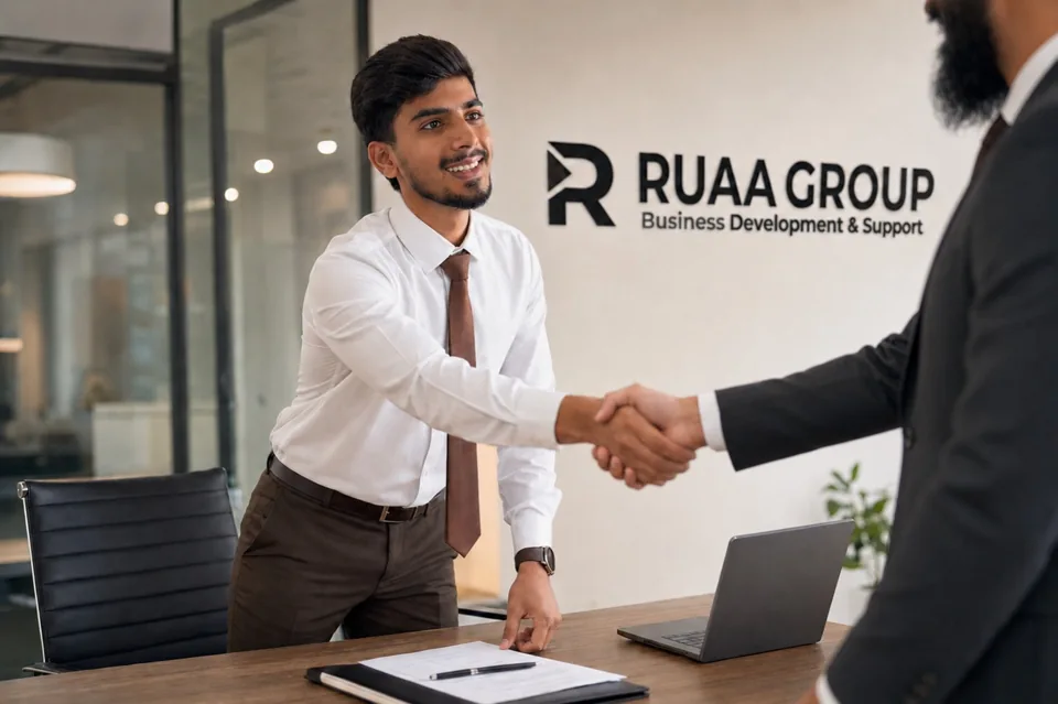 Shahzaib greeting a business partner at the RUA office